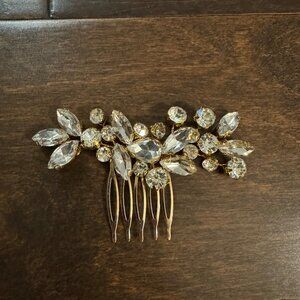 Gold hair piece with white stones